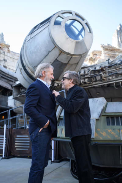 Star Wars Actors Tour Star Wars: Galaxy’s Edge at Disneyland Park Ahead of Opening Actors Harrison Ford, and Mark Hamill pose in front of the Millennium Falcon at Star Wars: Galaxy’s Edge at Disneyland Park in Anaheim, California, May 29, 2019. Star Wars: Galaxy’s Edge opens May 31, 2019, at Disneyland Resort in California and Aug. 29, 2019, at Walt Disney World Resort in Florida.  (Richard Harbaugh/Disneyland Resort)