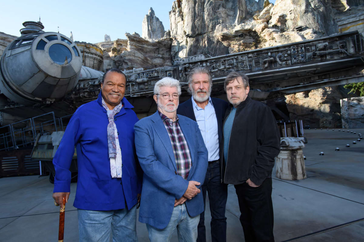 Star Wars Actors Tour Star Wars: Galaxy’s Edge at Disneyland Park Ahead of Opening Actor Billy Dee Williams, Star Wars creator George Lucas, actors Harrison Ford and Mark Hamill pose in front of the Millennium Falcon at Star Wars: Galaxy’s Edge at Disneyland Park in Anaheim, California, May 29, 2019. Star Wars: Galaxy’s Edge opens May 31, 2019, at Disneyland Resort in California and Aug. 29, 2019, at Walt Disney World Resort in Florida.  (Richard Harbaugh/Disneyland Resort)