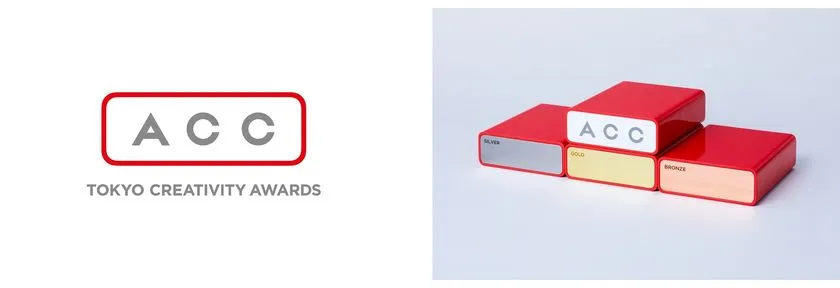 ACC TOKYO CREATIVITY AWARDSのロゴと、SILVER・GOLD・BRONZEの3段階トロフィー（赤い直方体ブロック型）を並べた受賞トロフィー紹介写真。