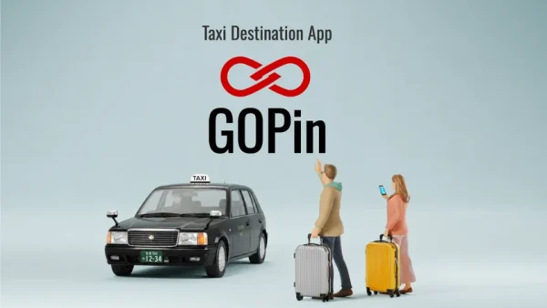 GOPinアプリのキービジュアル。黒いタクシー車両とスーツケースを持つ外国人旅行者2人のミニチュア人形を配置し、上部に赤いインフィニティロゴと「GOPin」のロゴタイプを表示したアプリ紹介画像