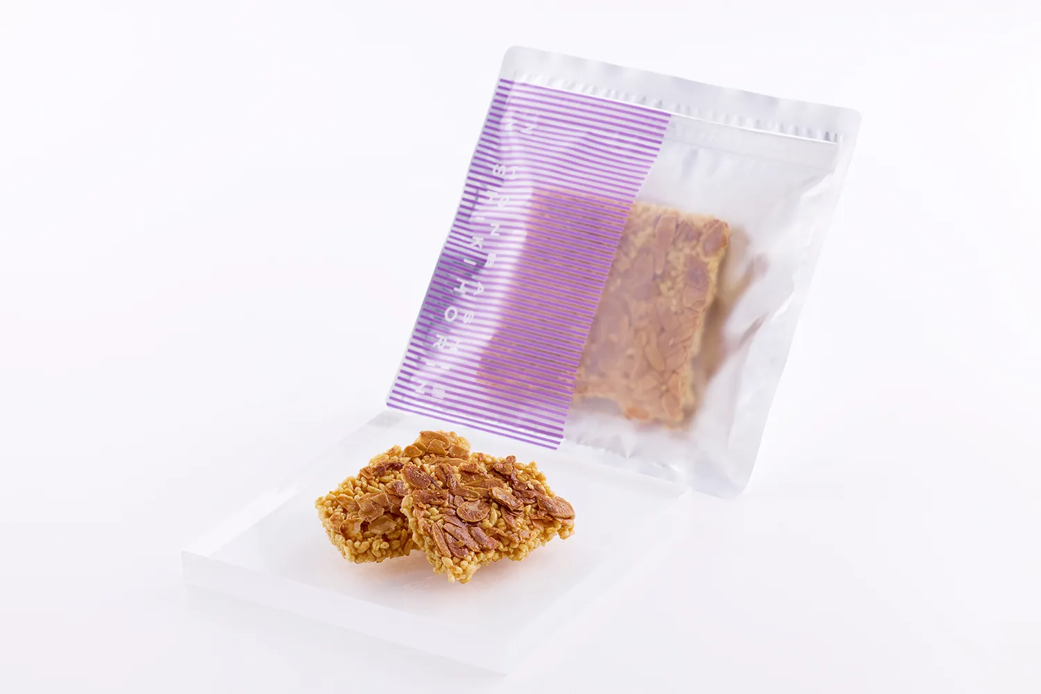 「okoshi+ フロランタン」70gの紫ストライプパッケージ