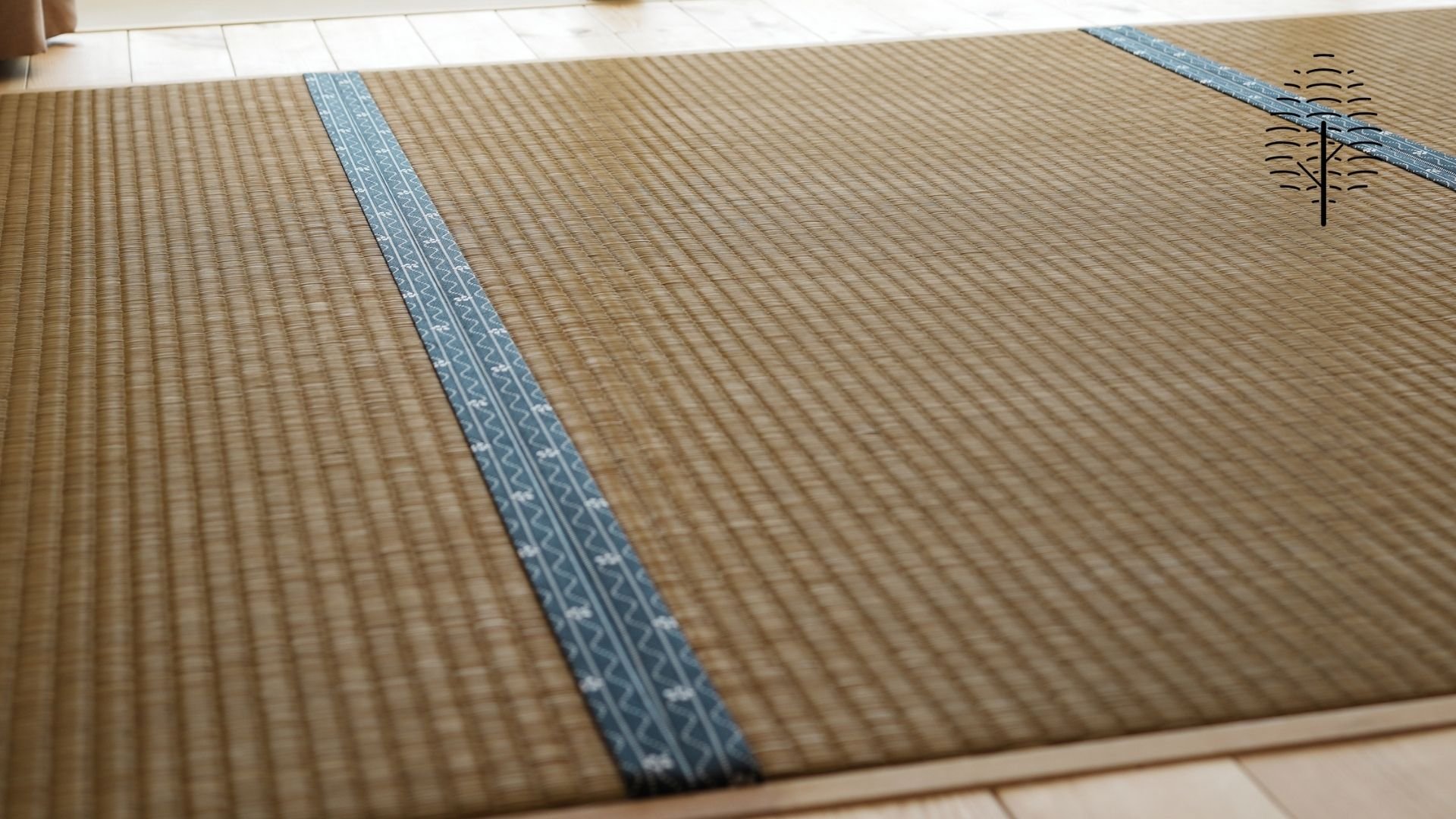 「ミ森 -MIMORI-」の客室に敷かれた沖縄ビーグ畳の織り目と縁のクローズアップ