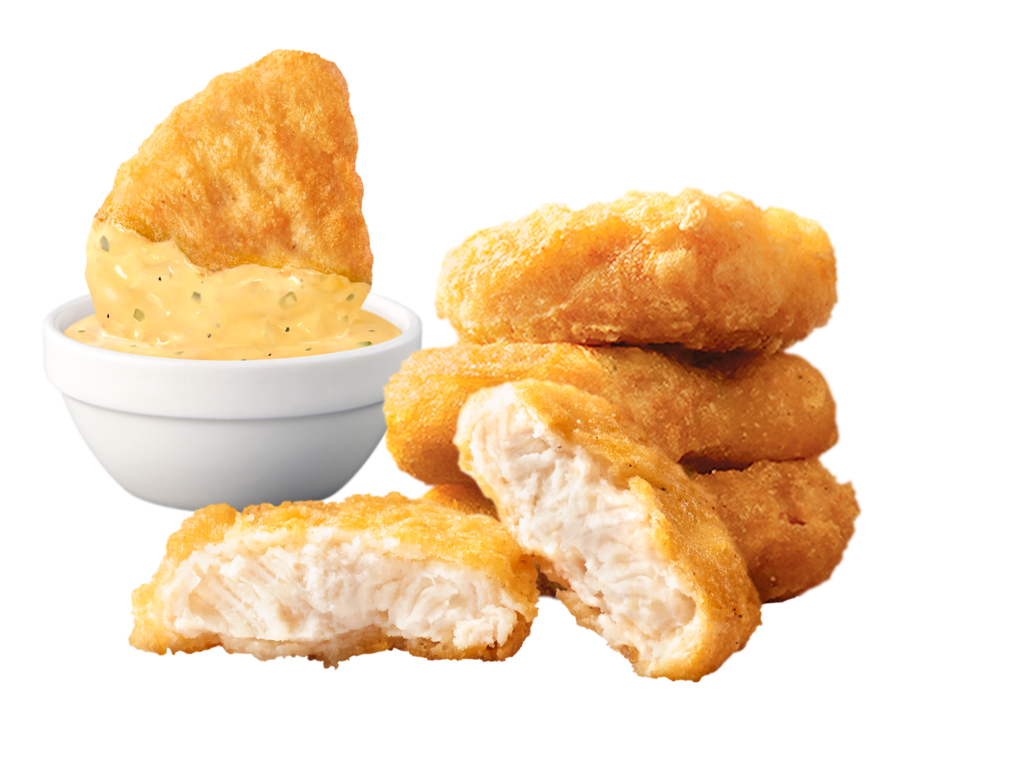 粒入りの黄色いタルタルソースを添えたチキンマックナゲット