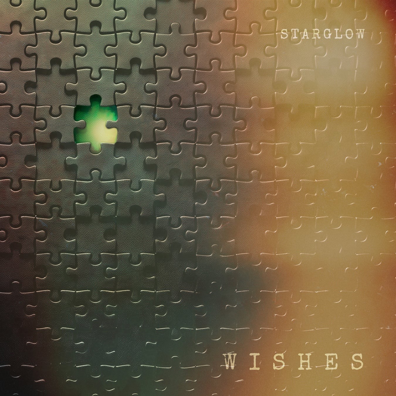 STARGLOW「WISHES」のジャケット。ジグソーパズルと光を描いたデザイン